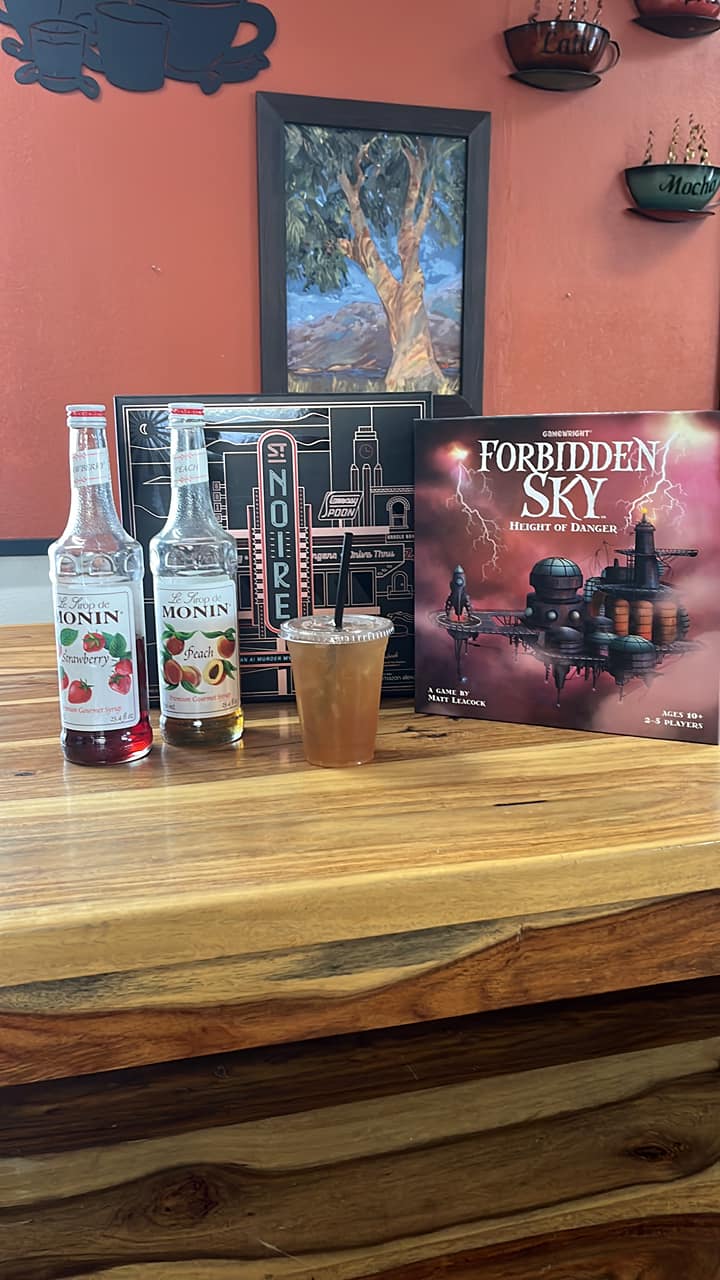 Inside Fog Hill Coffee — drinks, syrups, and board games on the wood counter
